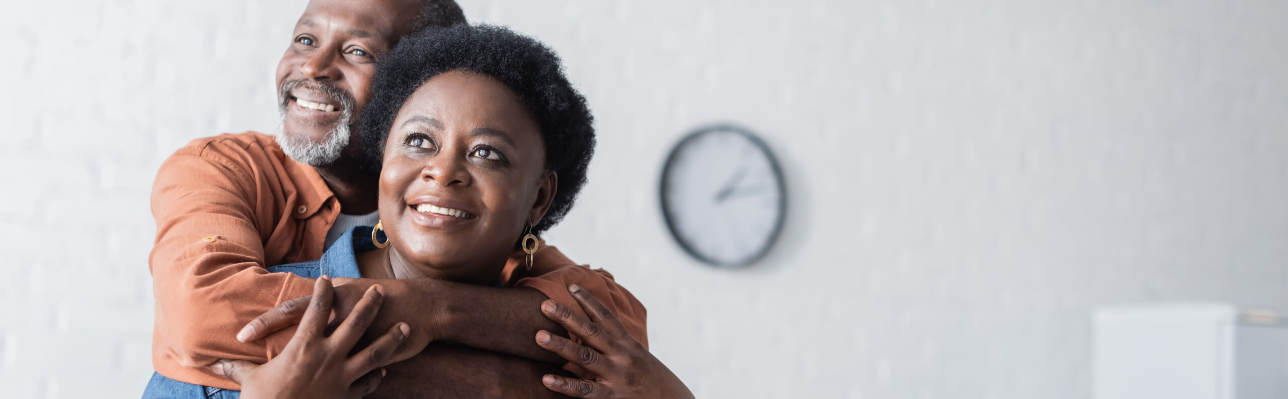 happy and senior african american man embracing smiling wife, banner. happy and senior african american man embracing smiling wife, banner,stock image